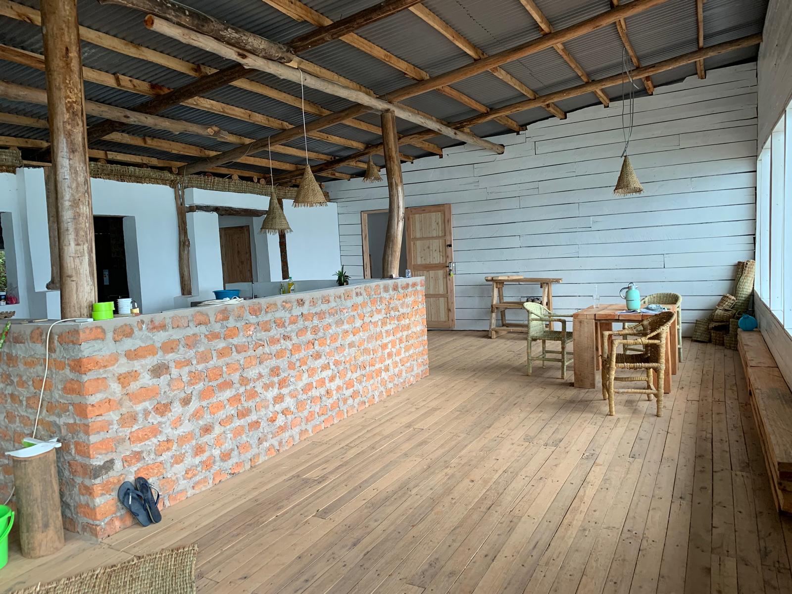 The finished lounge with its brick bar and timber floor