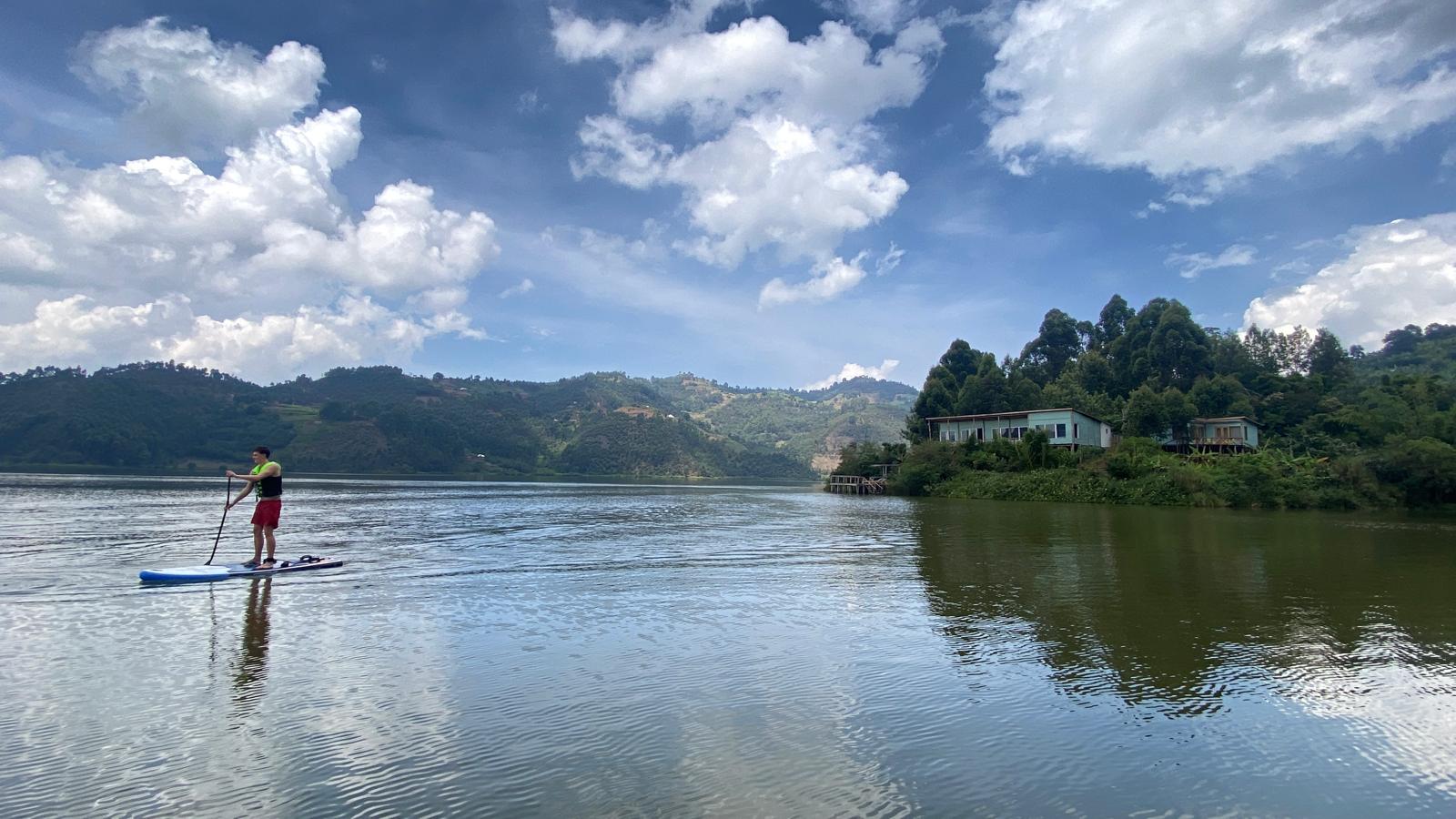 Paddleboarding on Lake Mulehe with the lodge in view
